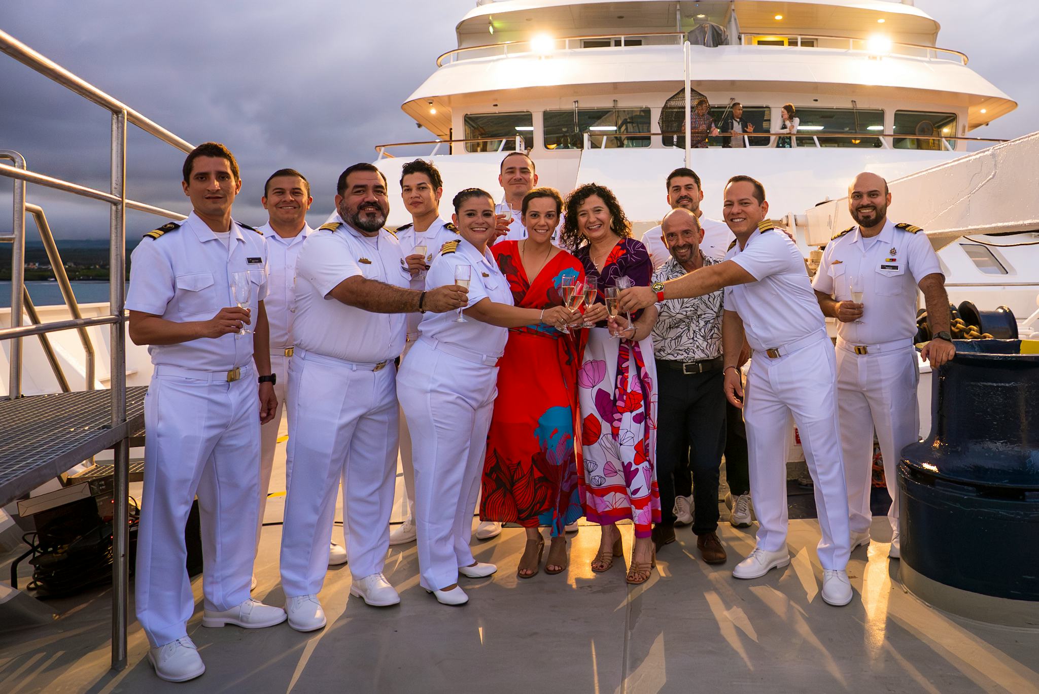 https://img.cruisecritic.net/cms-sb/f/1005231/2677x1788/38b8b4d99f/national-geographic-lindblad-two-ships-galapagos-naming-ceremony-crew.jpg?auto=format%2Cenhance&crop=entropy&fit=crop&ixlib=react-9.10.0&q=50&w=2048